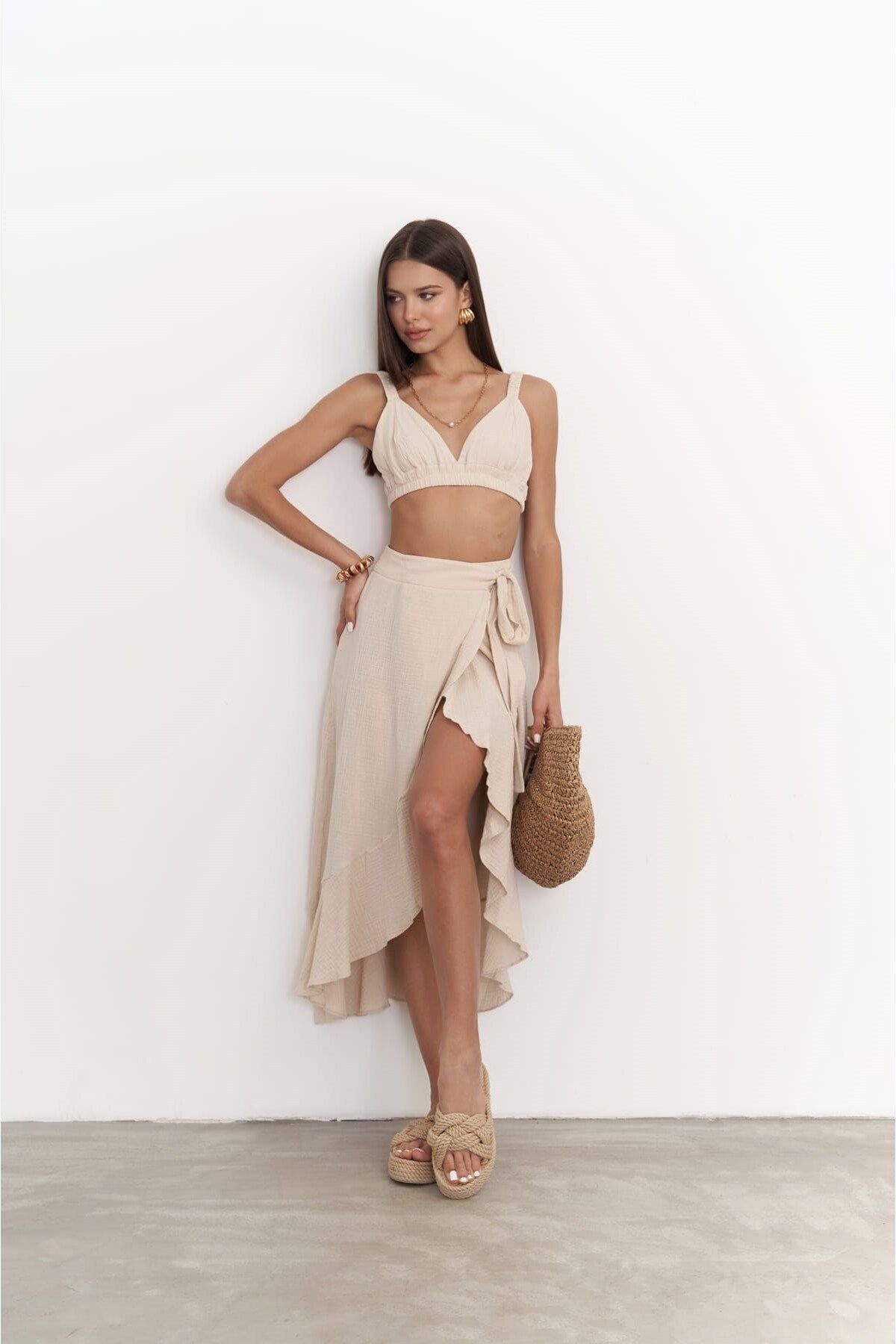 Model wearing sand beige muslin crop top and wrap skirt set — SHAÉN summer outfit.
