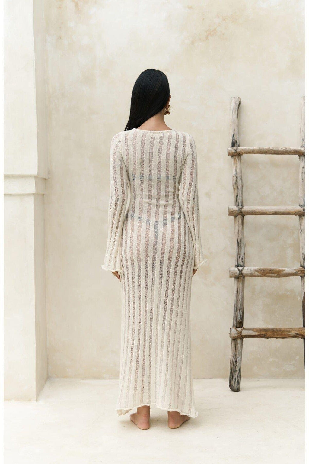 Minimalist beach cover-up in natural tone with semi-sheer vertical texture