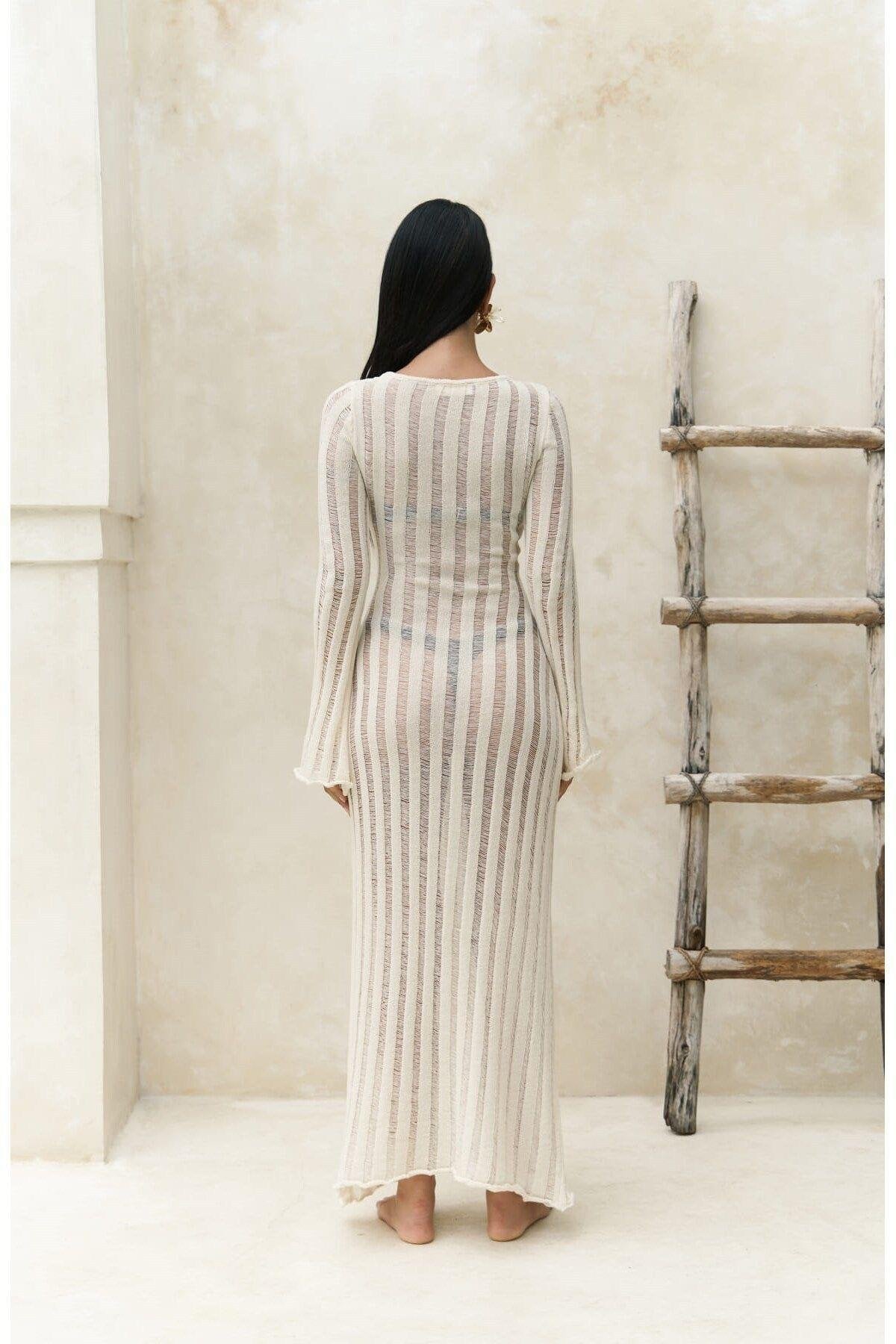 Minimalist beach cover-up in natural tone with semi-sheer vertical texture