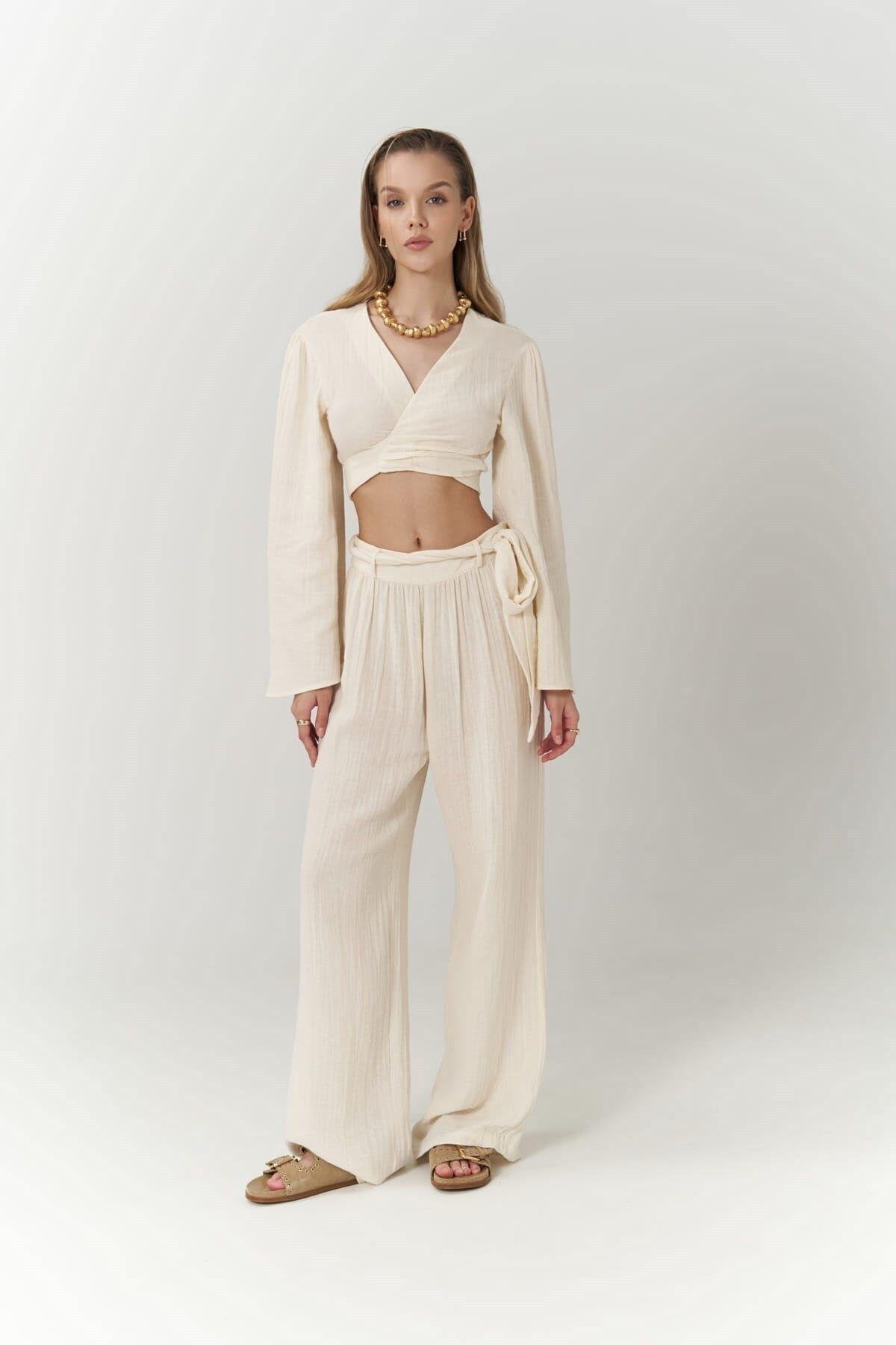 Woman wearing natural muslin boho chic wrap set in studio
