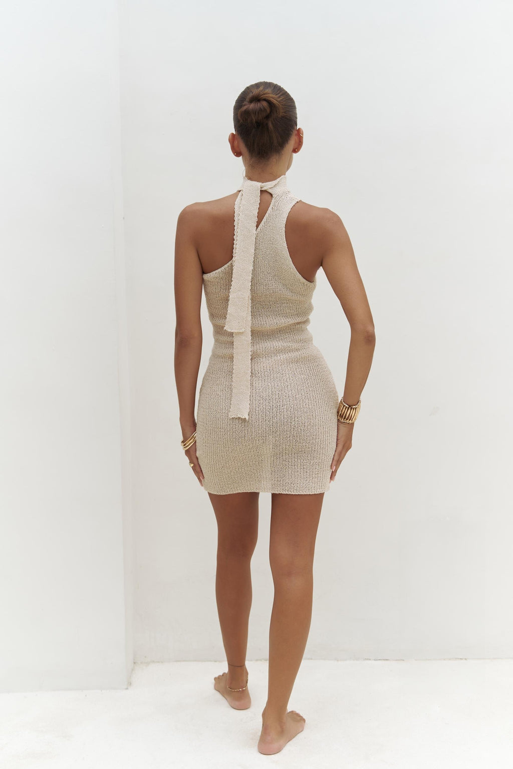 Back view of midi knit texture and asymmetrical neckline on Nyra dress